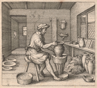 A bearded man in early modern clothing is sitting at a pottery wheel turning a pot. He is sitting on a chair in a house with various bowls and pitchers on the floor and shelves.
